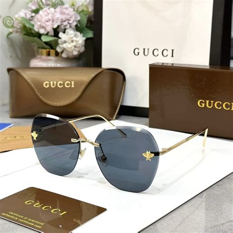 red Gucci sunglasses with bee